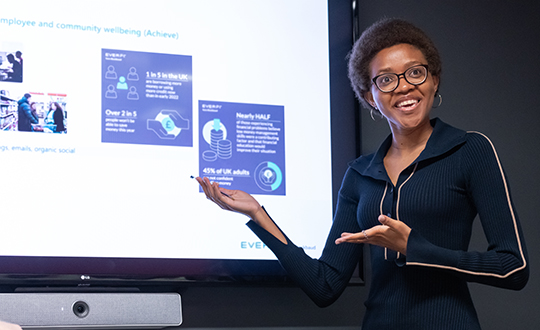 Young woman delivering a presentation with purpose